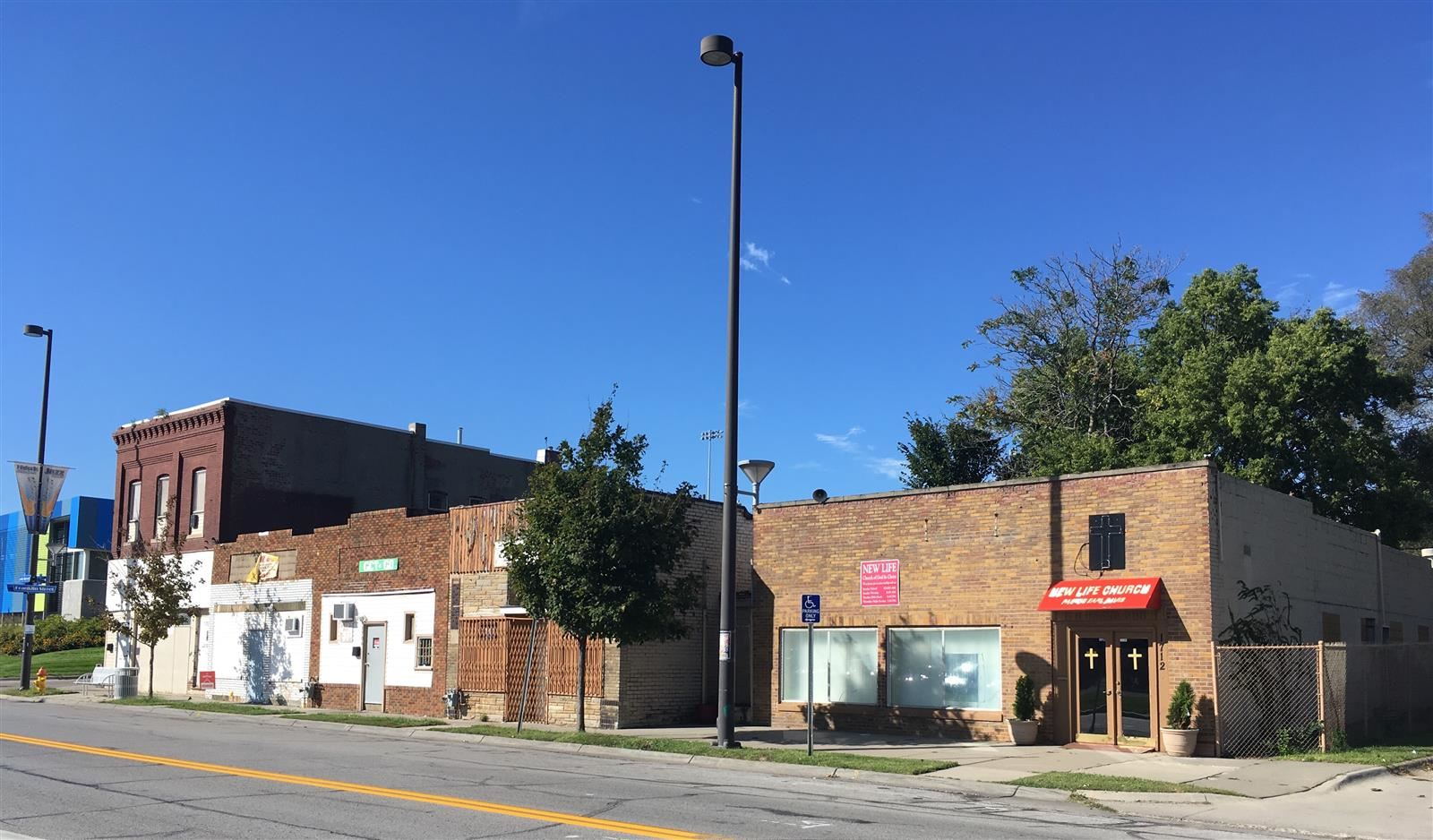 Modern image of a stretch of the Long School Neighborhood with functional and run down buildings Modern image of a stretch of the Long School Neighborhood with functional and run down buildings
